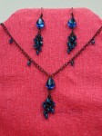Černý náhrdelník a náušnice s modrými kamínky